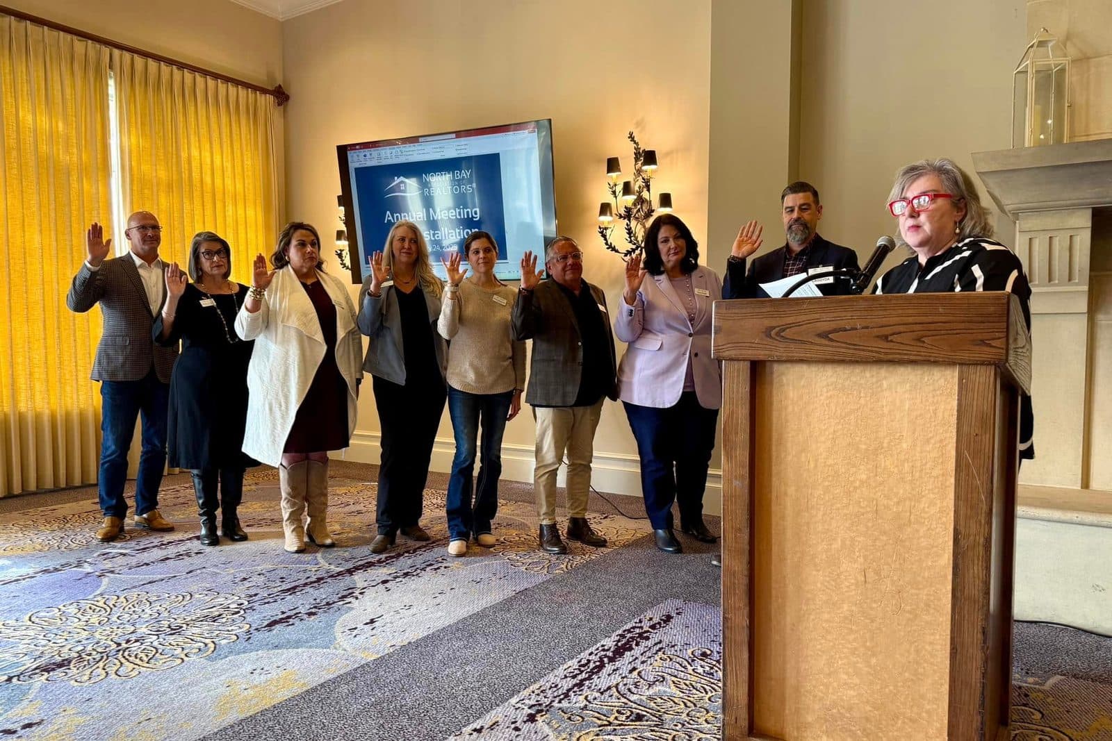 Incoming NORBAR directors stand with right hands raised taking the oath of office at the 2025 Annual Meeting and Installation.