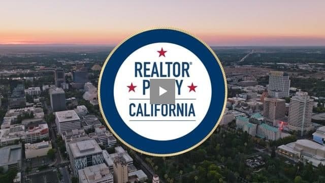 REALTOR Party California seal over an aerial view of downtown Sacramento at dusk.