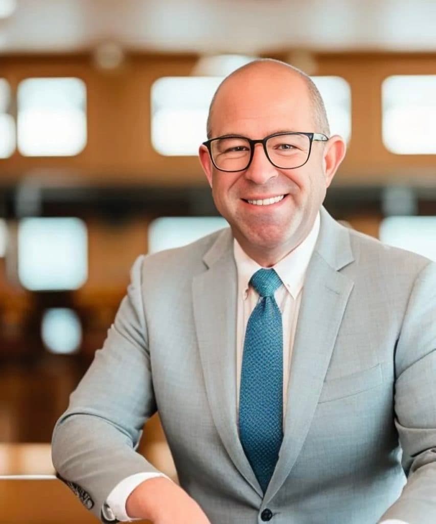 Headshot of Jordan Levine, CAR Senior Vice President and Chief Economist, smiling in a grey suit and blue tie.