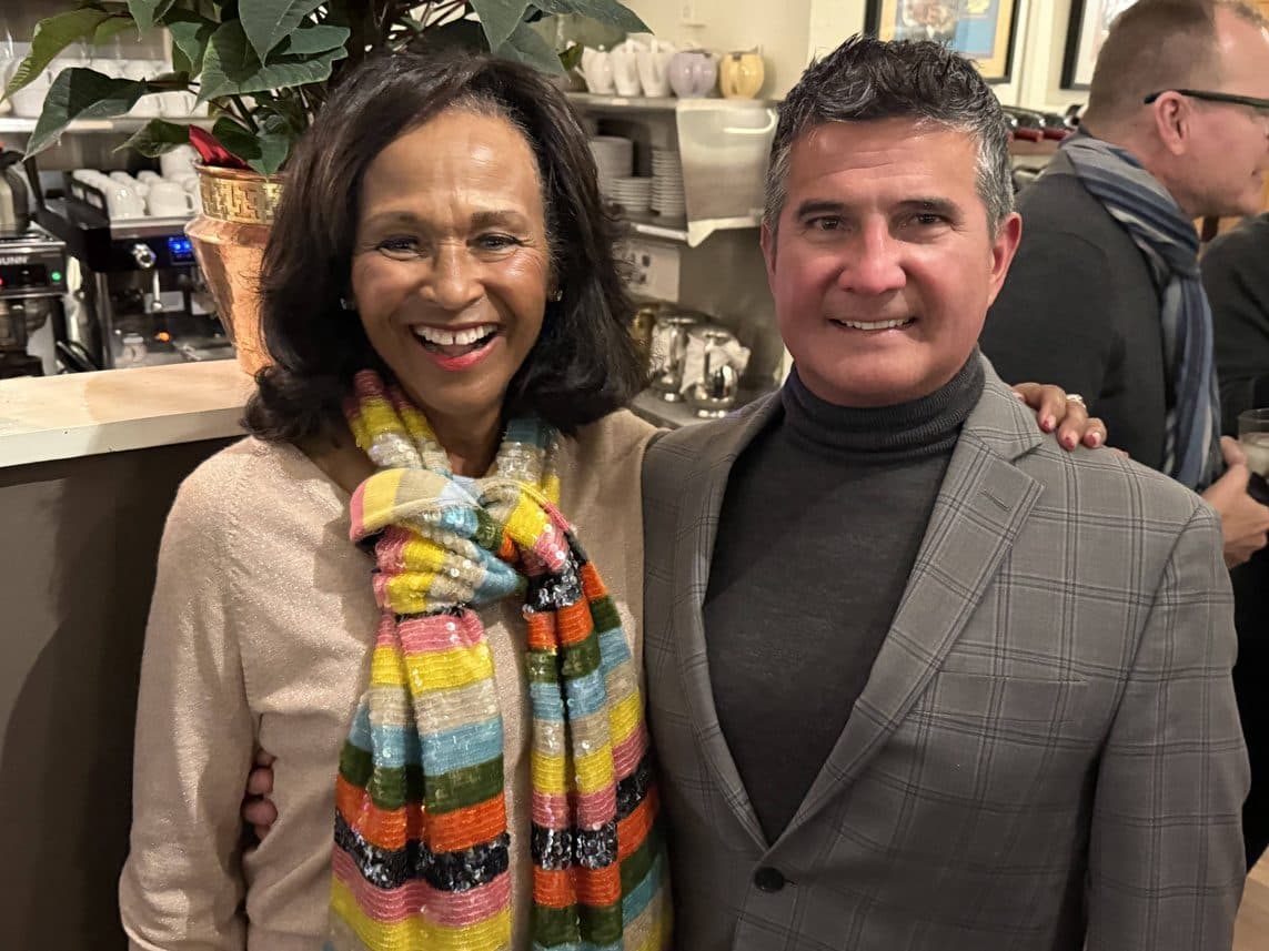 Two smiling members pose together at one of NORBAR's Chapter holiday parties.