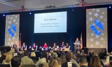 A general session at CAR's Legislative Day: a panel seated on a stage beneath a screen reading "Toni Atkins, President Pro Tempore, California State Senate", with a speaker at the podium and a full audience in the foreground.